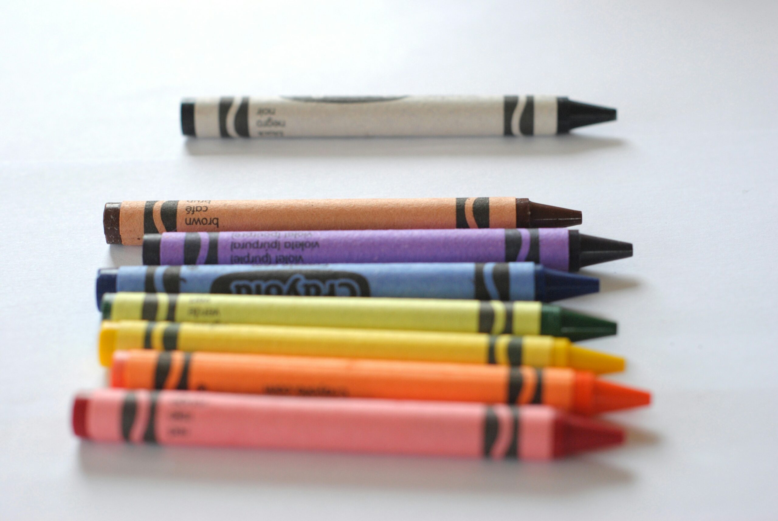 Colored crayons on a table.