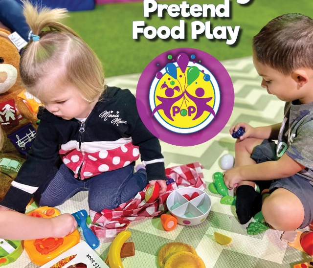 Two children using pretend food play at a Power of Play Groups Class.